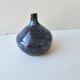 Small blue soliflore vase in glazed ceramic signed X (to be identified)