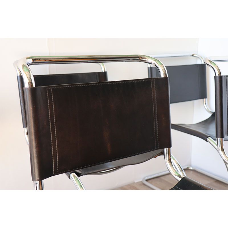 Series of 6 minimalist chairs in chrome metal and black leather around 1970