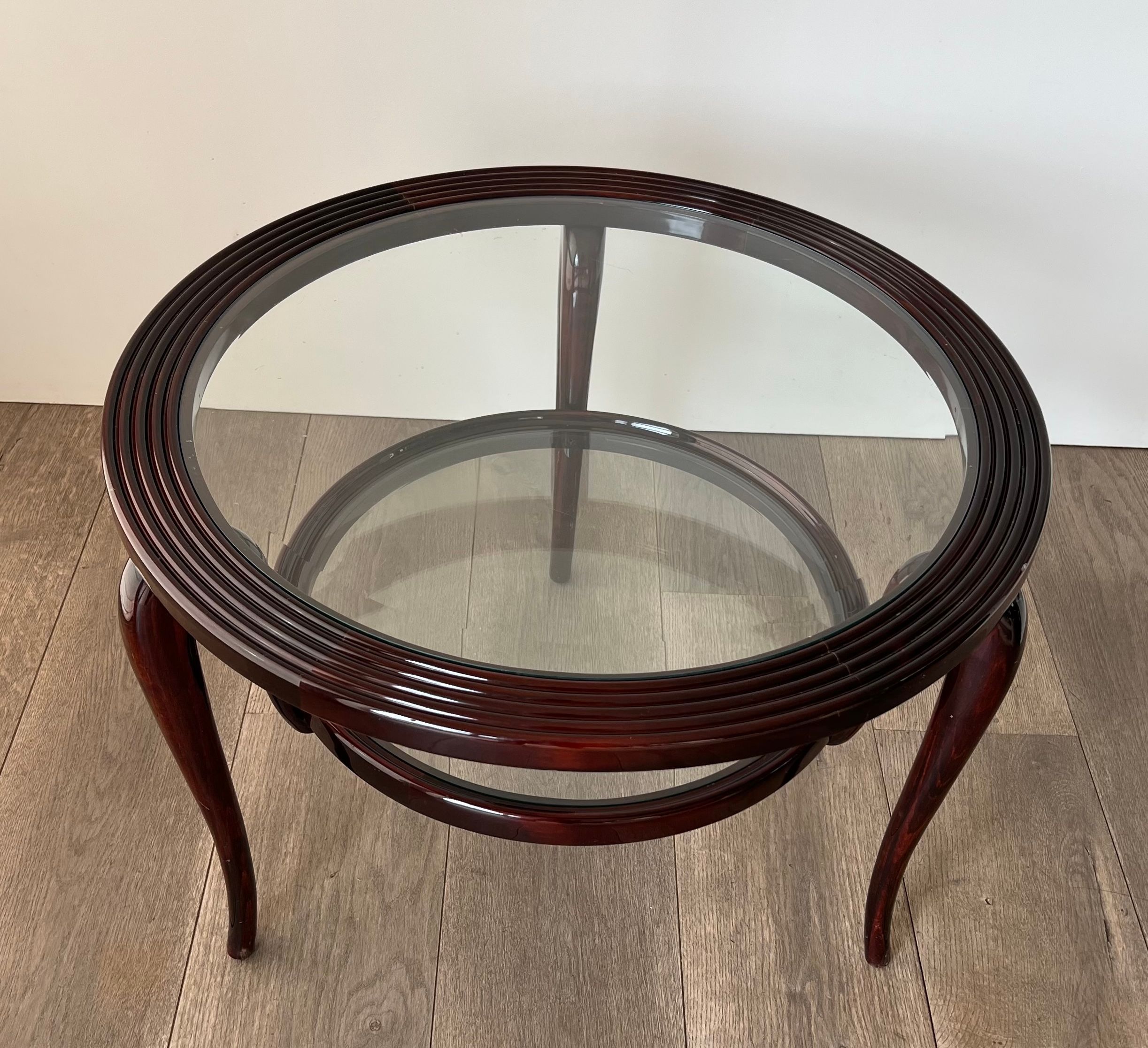 Round mid-century coffee table in walnut with a double top by Paolo Buffa.