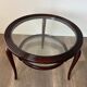 Round mid-century coffee table in walnut with a double top by Paolo Buffa.