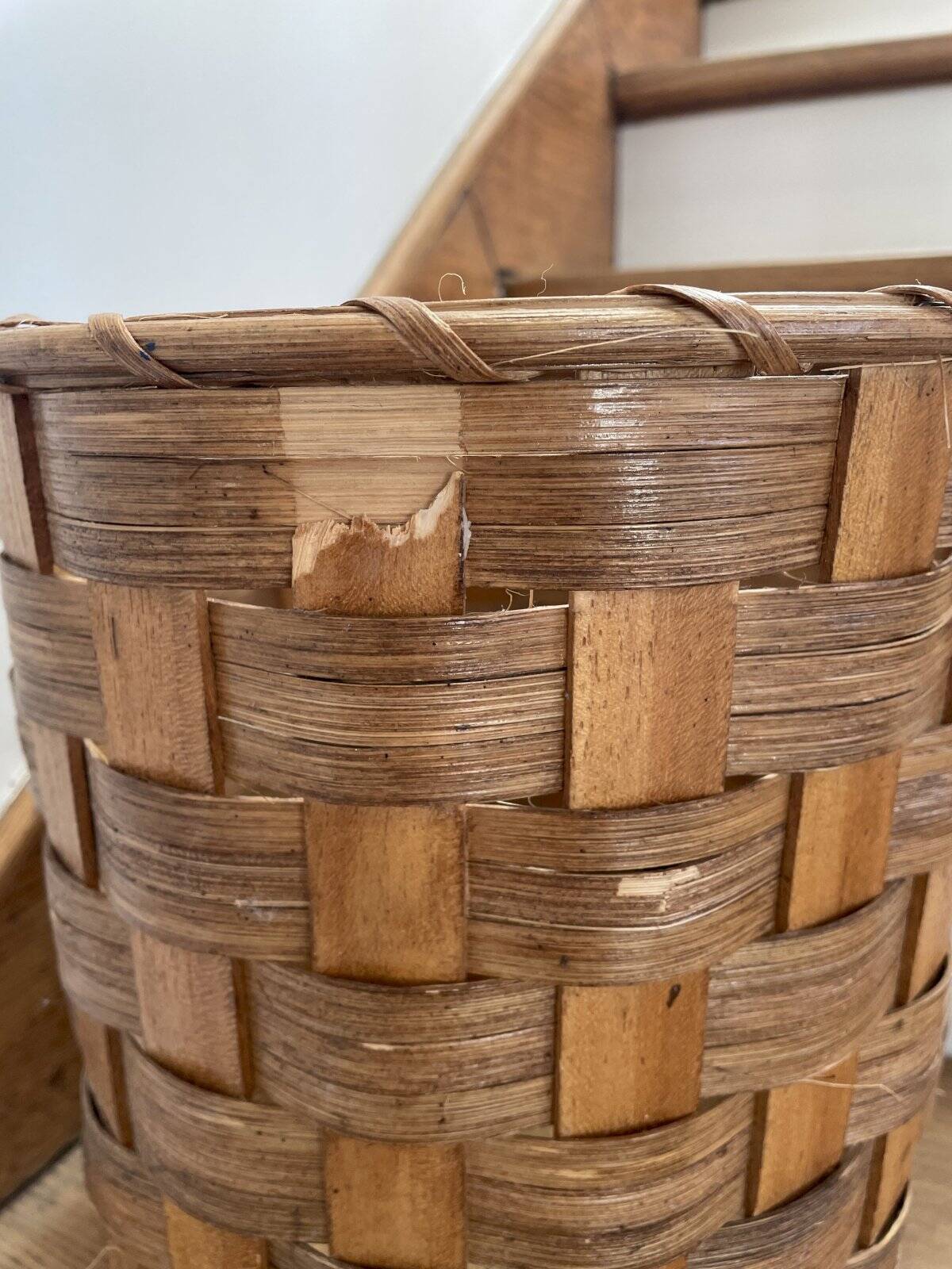 Oval wicker and wood woven wastepaper basket