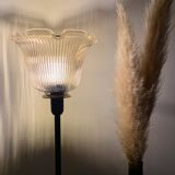 Table lamp with a lampshade with magnificent golden reflections