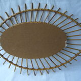 Vintage oval mirror in rattan