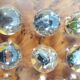 Vintage wooden solitaire game with resin balls and insects – Madaga