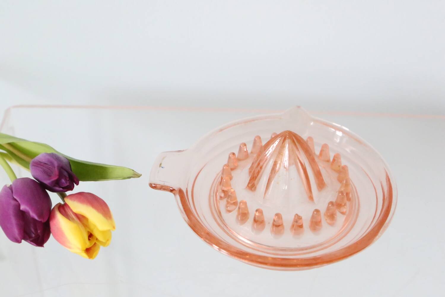 Adorable pink glass juicer