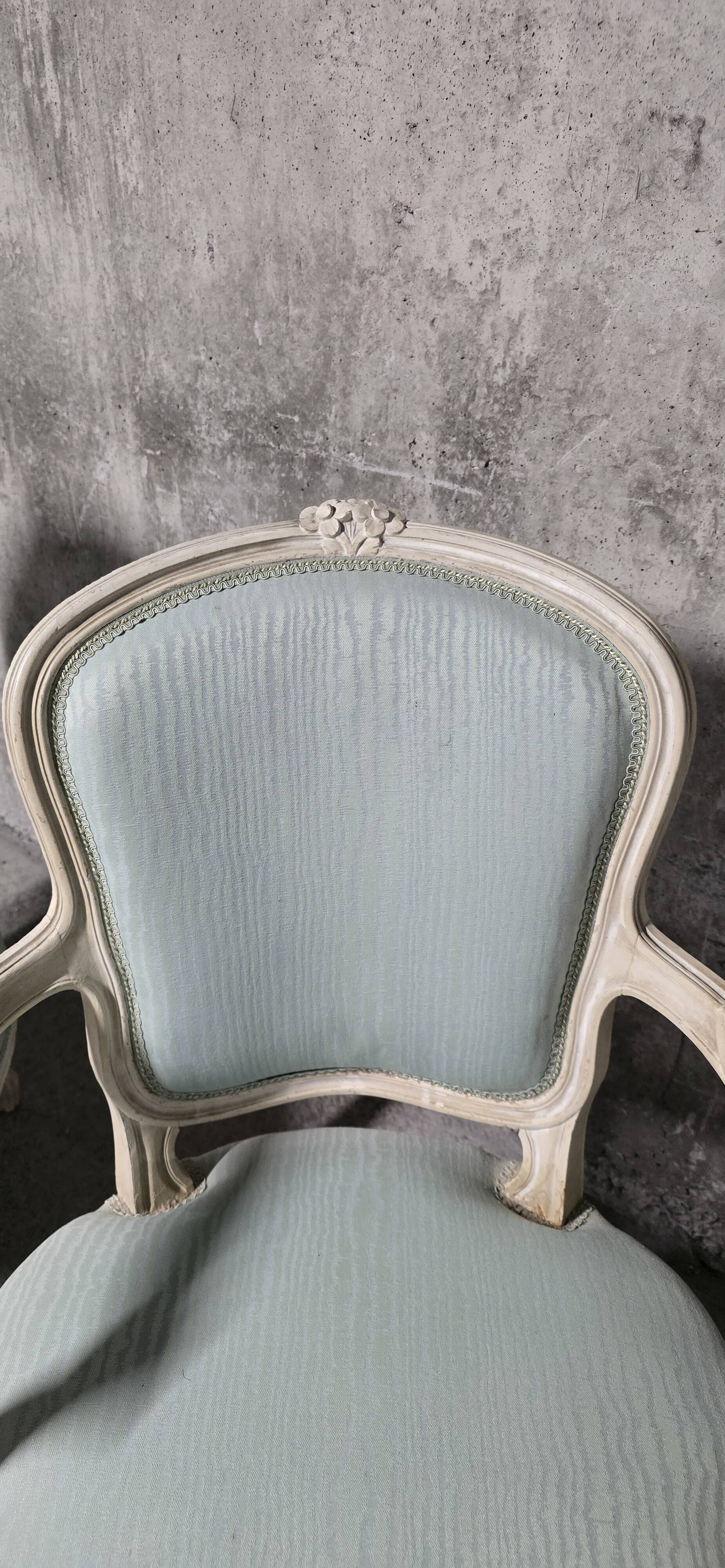 Pair of Louis XV style armchairs in patinated wood, light blue fabric.