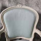 Pair of Louis XV style armchairs in patinated wood, light blue fabric.