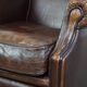 Wing chair made of sheepskin and neatly finished with black piping