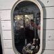 Oval mirror in white lacquer from the 1970s.