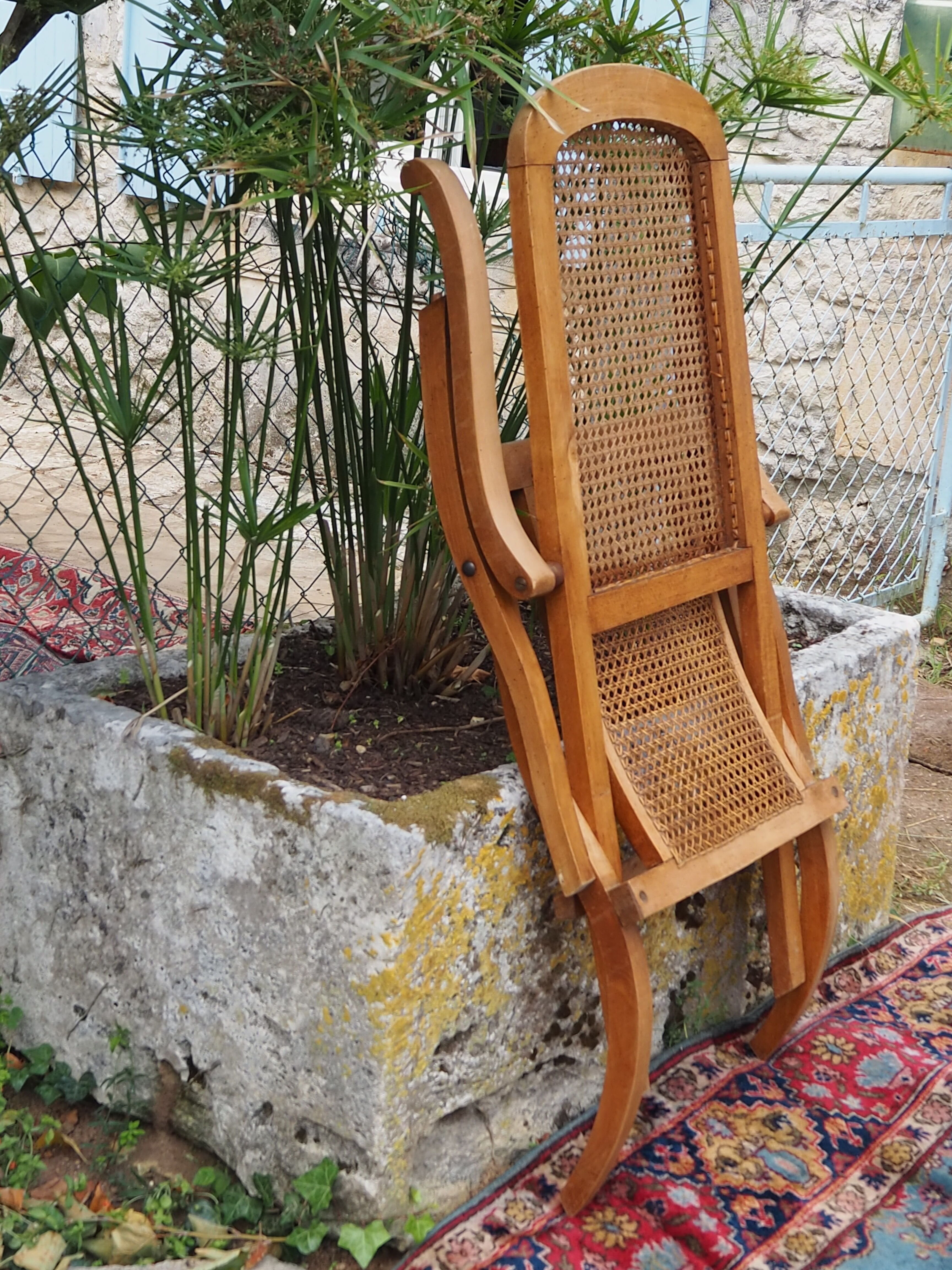 Cane folding armchair in solid wood