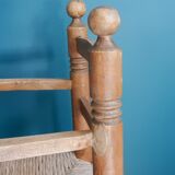 Children's high chair made of wood and straw