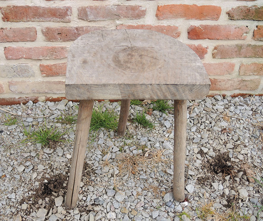 Old raw wood milking stool