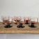 6 pink bowls with black stems