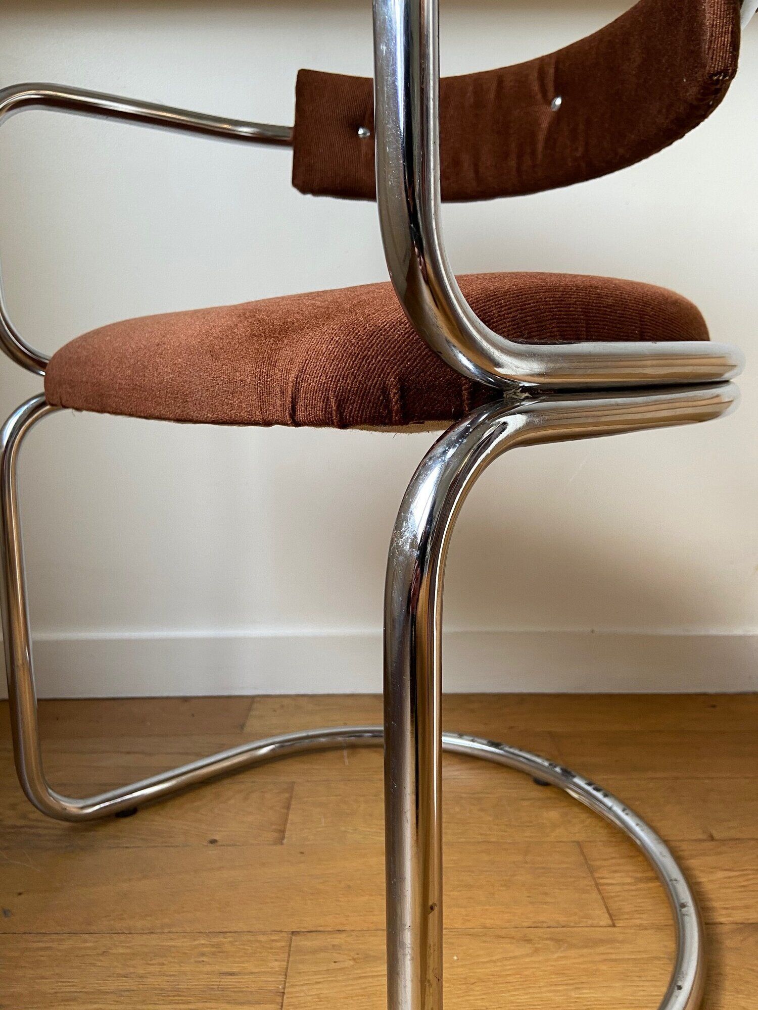 Chrome aluminum chair and brown cotton