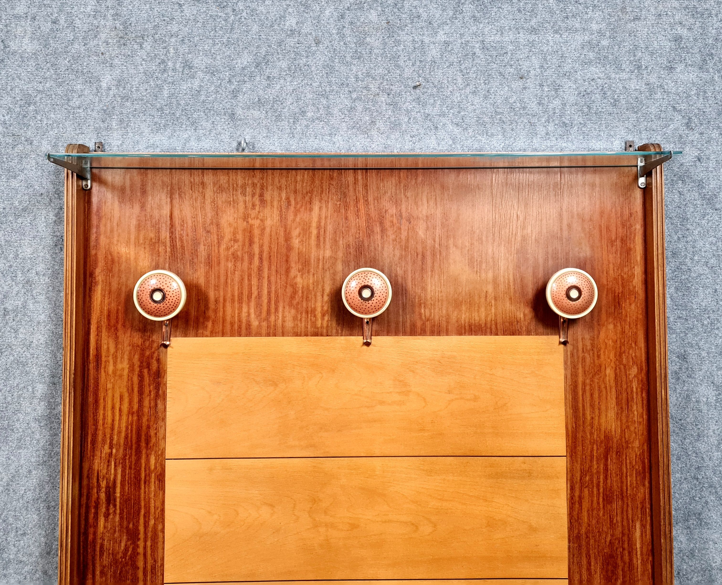 Art deco period coat rack in mahogany and light wood around 1940