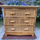 Vintage rattan chest of drawers has 3 drawers.