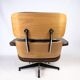 Fauteuil lounge Charles Eames en cuir marron et noyer clair