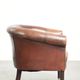 Sheepskin club armchair with patina in a subtle size and a vintage look