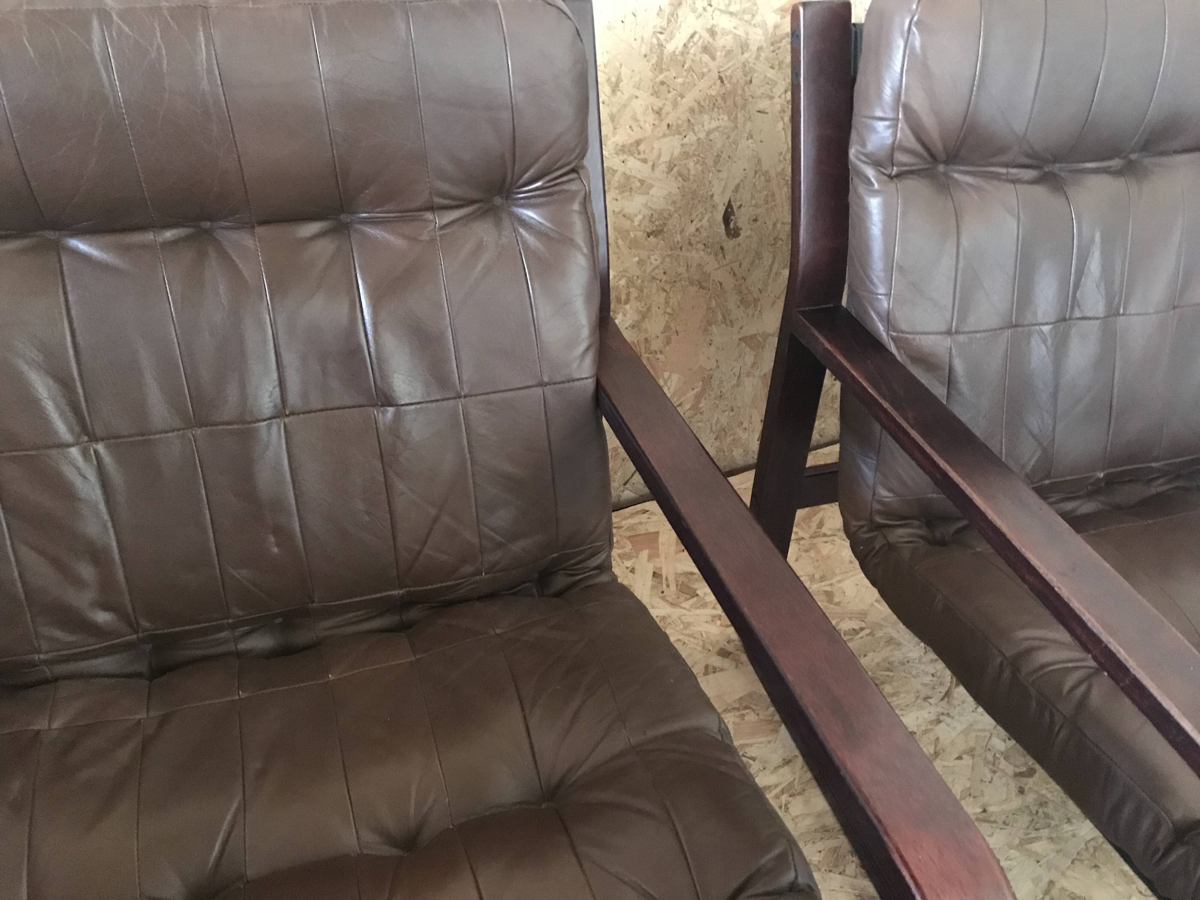 Pair of vintage armchairs in curved wood with suspended seat circa 1970-80.