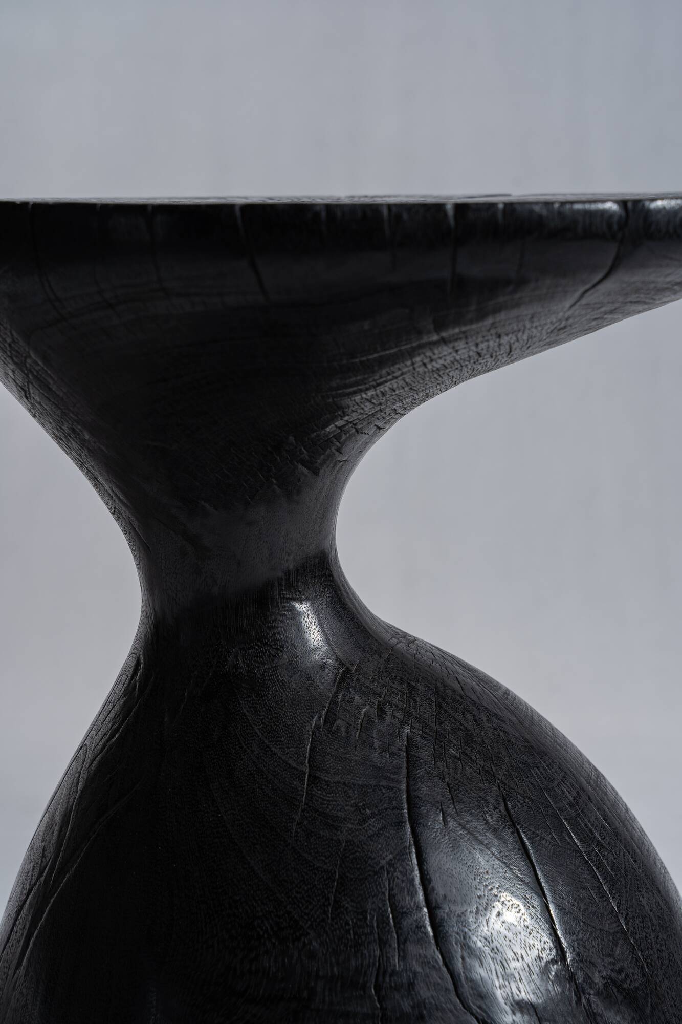 Solid wood (monoxyl) side table, organic shape, black color