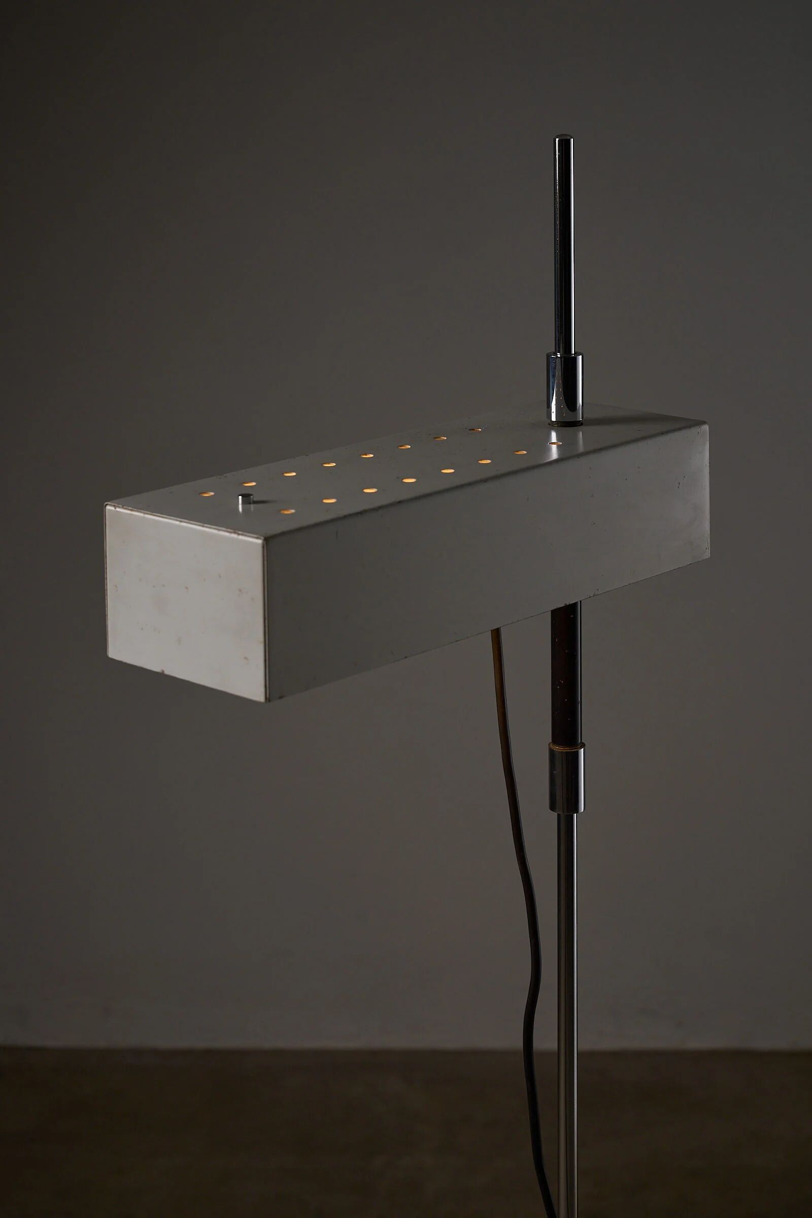 Adjustable perforated shade floor lamp