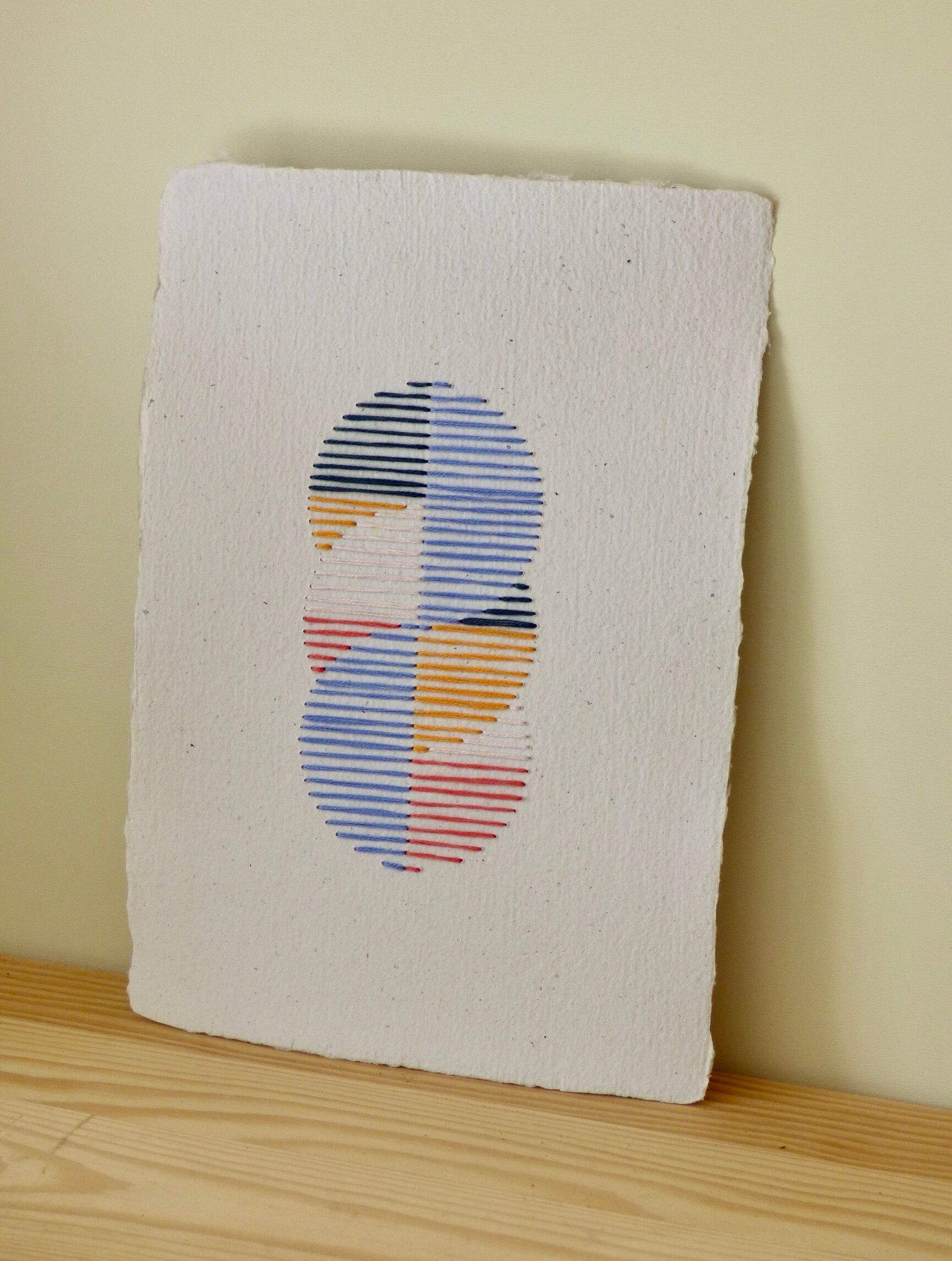 Embroidery on rag paper