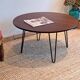 Round coffee table with mahogany wood top