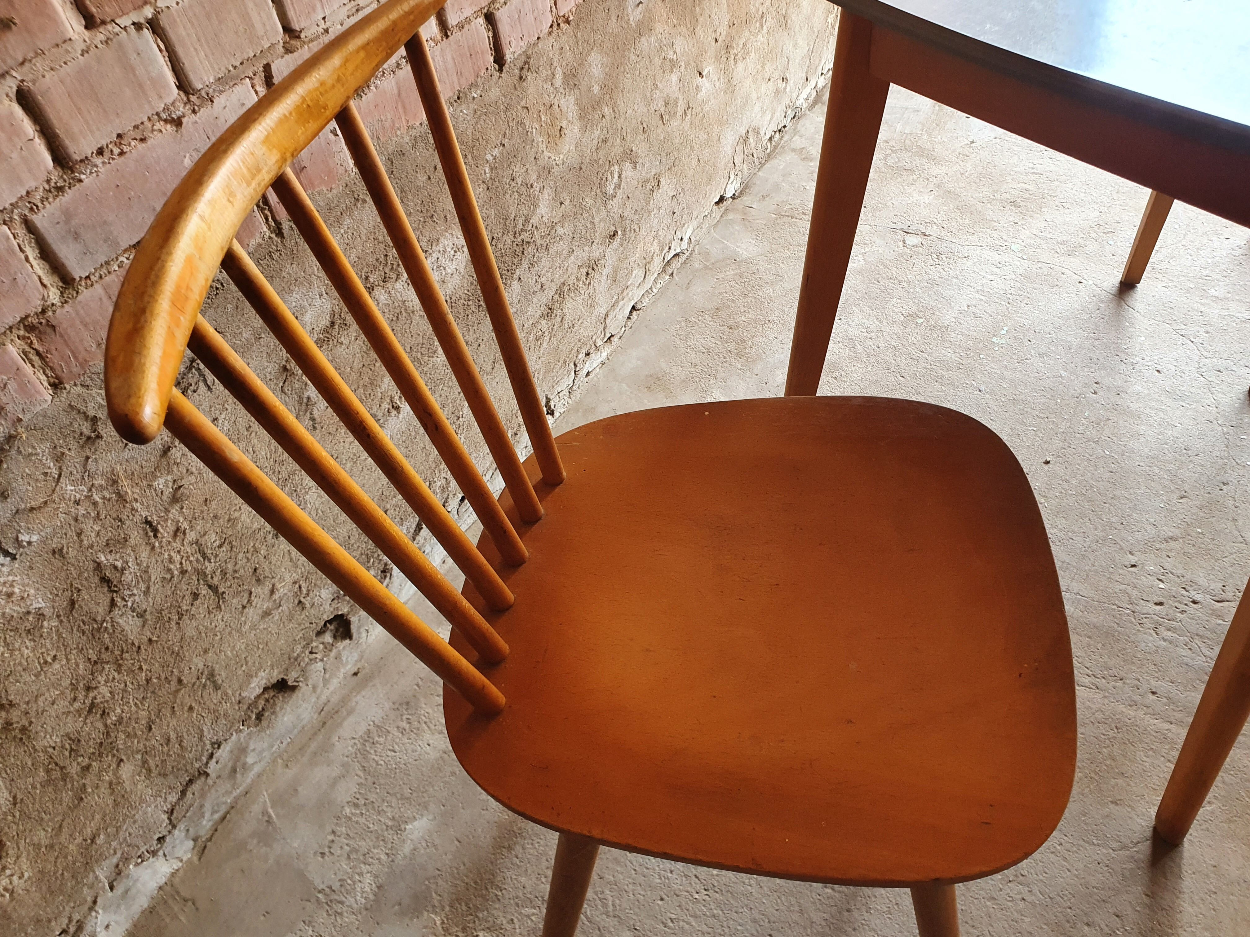 Together two Scandinavian chairs and its wooden and formica table