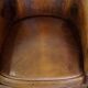 Set of 2 subtle, stately and sturdy club chairs made of sheepskin