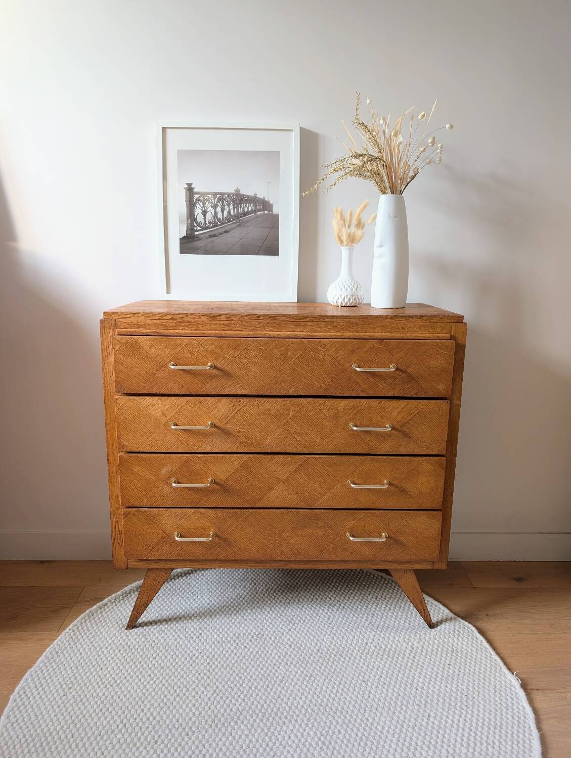 Vintage chest of drawers with checkerboard and compass feet