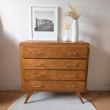 Vintage chest of drawers with checkerboard and compass feet