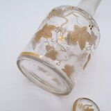 Old crystal carafe with golden decoration