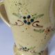 JP Daniel handmade earthenware pitcher – floral decoration on a yellow background