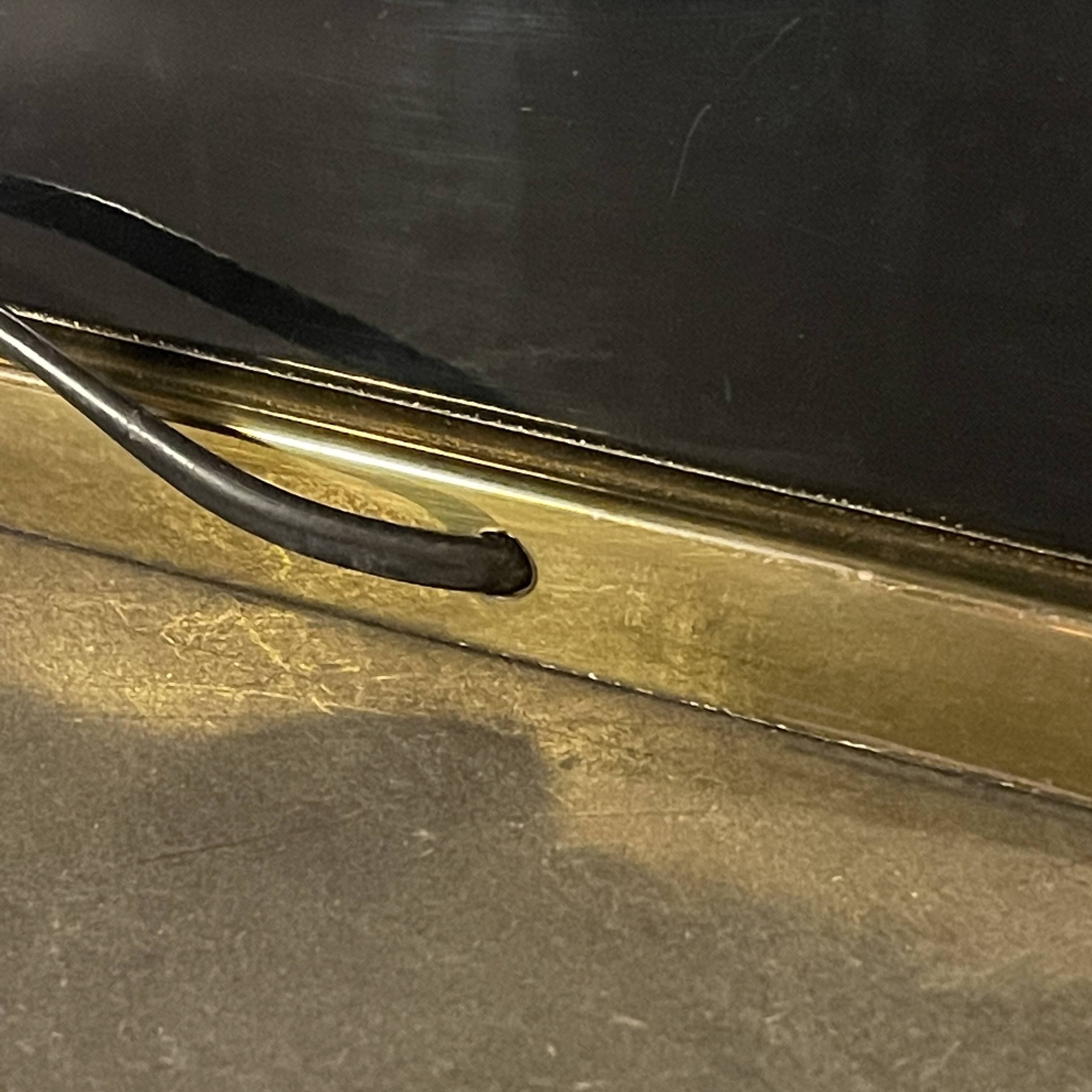 Pair of black lacquered and brass table lamps, circa 1970