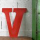 Industrial letter "V" in red metal