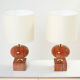 Pair of lamps in red travertine and brass 1970
