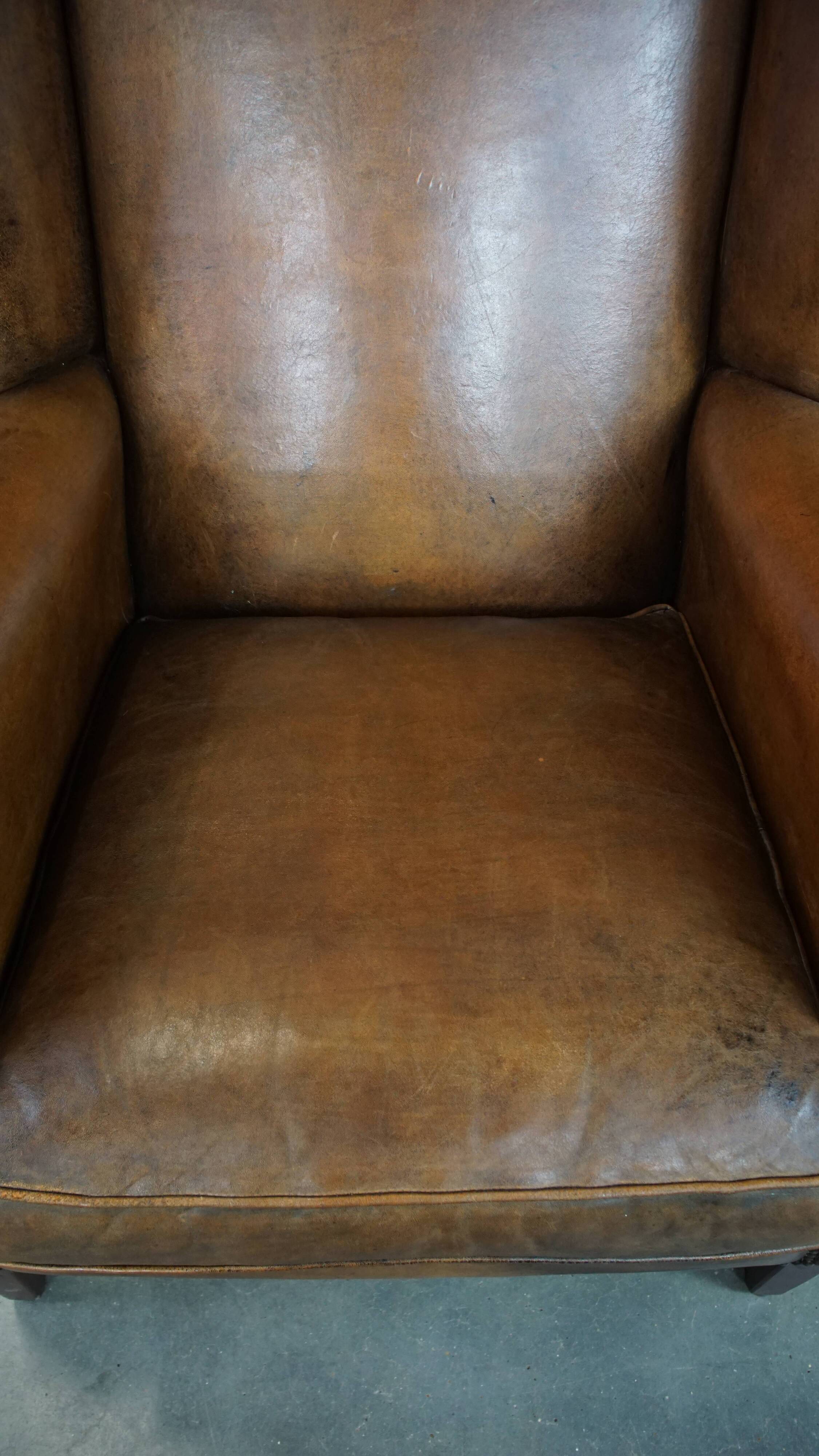 Sheep leather wingback chair with patina