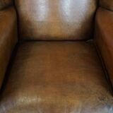 Sheep leather wingback chair with patina