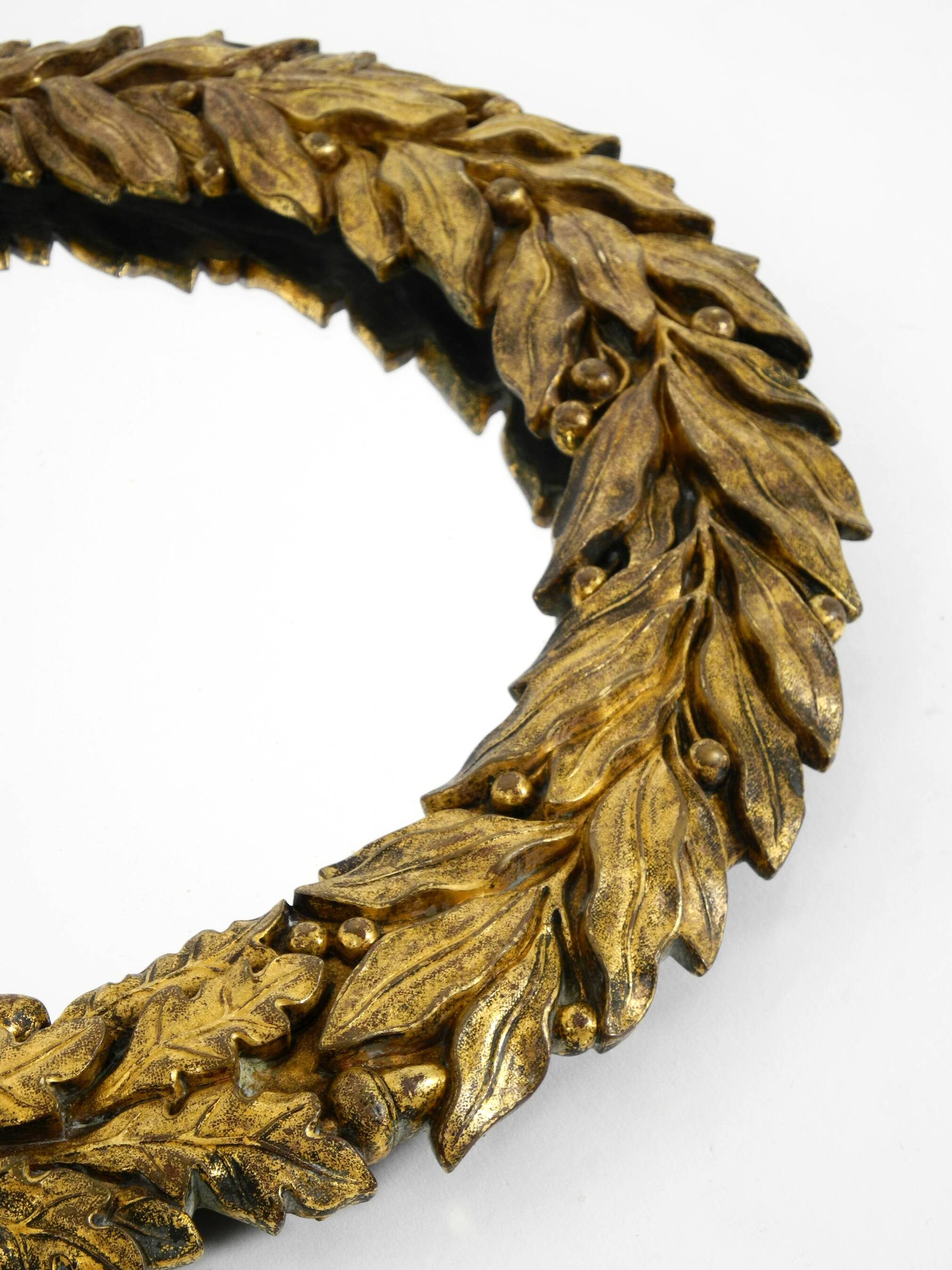 Beautiful small French mid-century wall mirror with an ornate brass frame