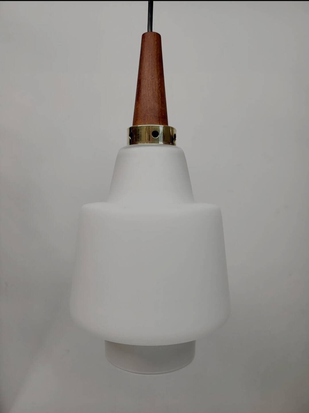 Scandinavian pendant light in opaline and teak, around 1960.