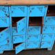 Old blue metal locker with wooden top