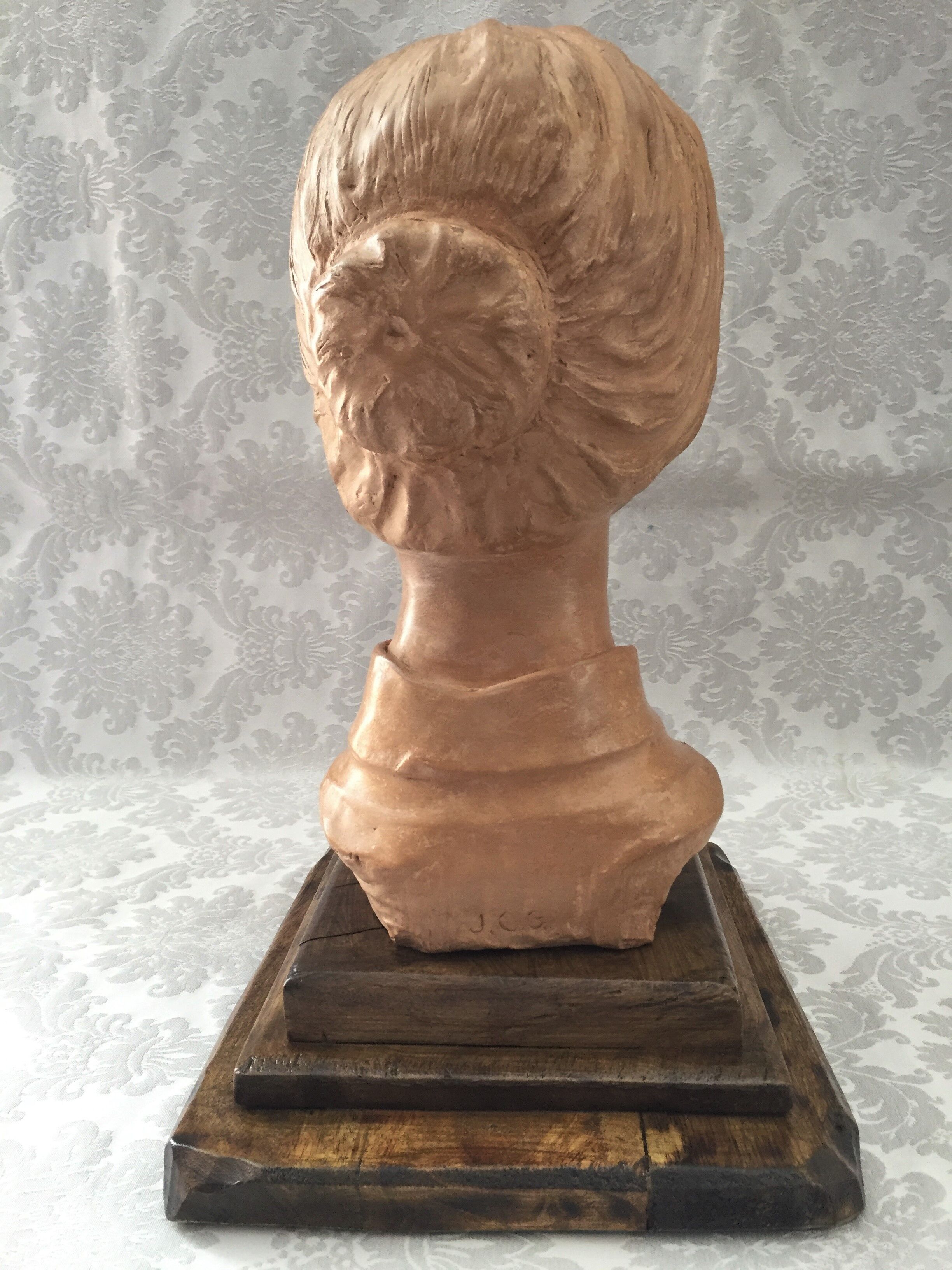 Bust in raw earth of atelier bust face of woman signed j.c.g.