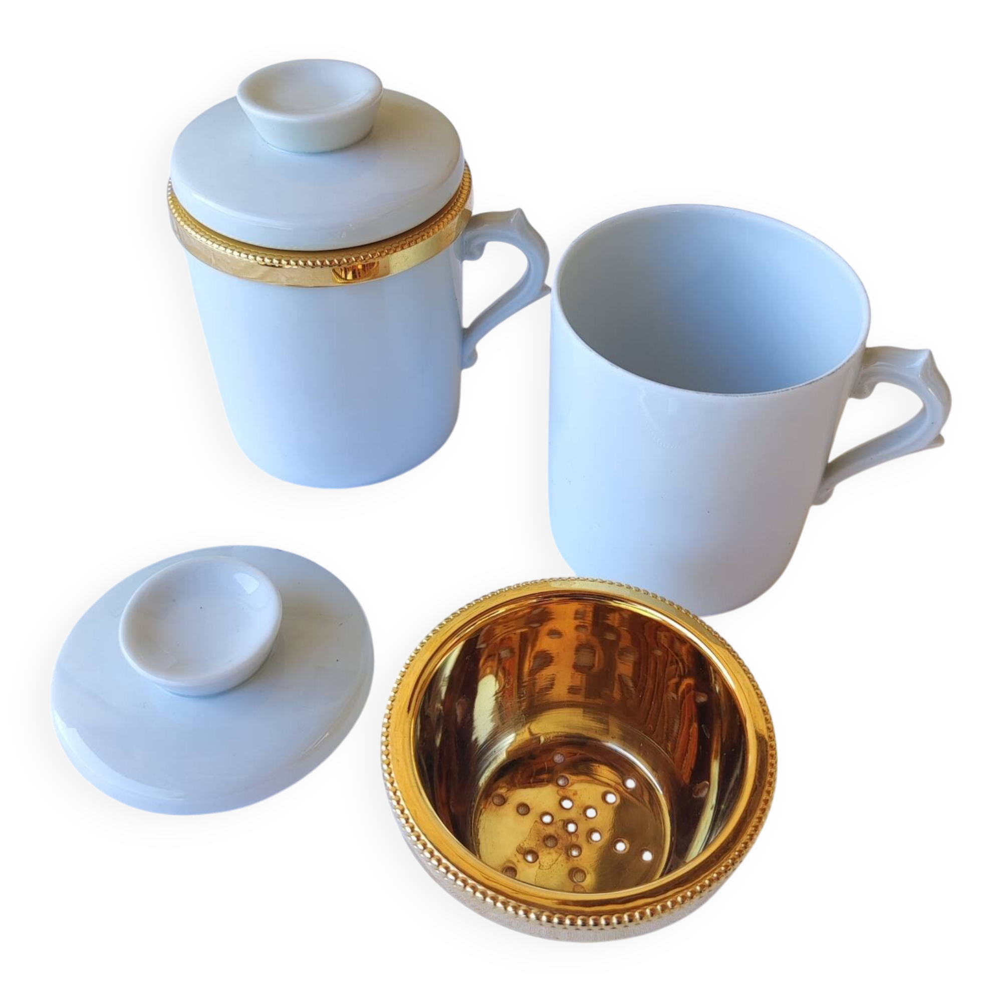 2 white and gold Limoges porcelain tea cups