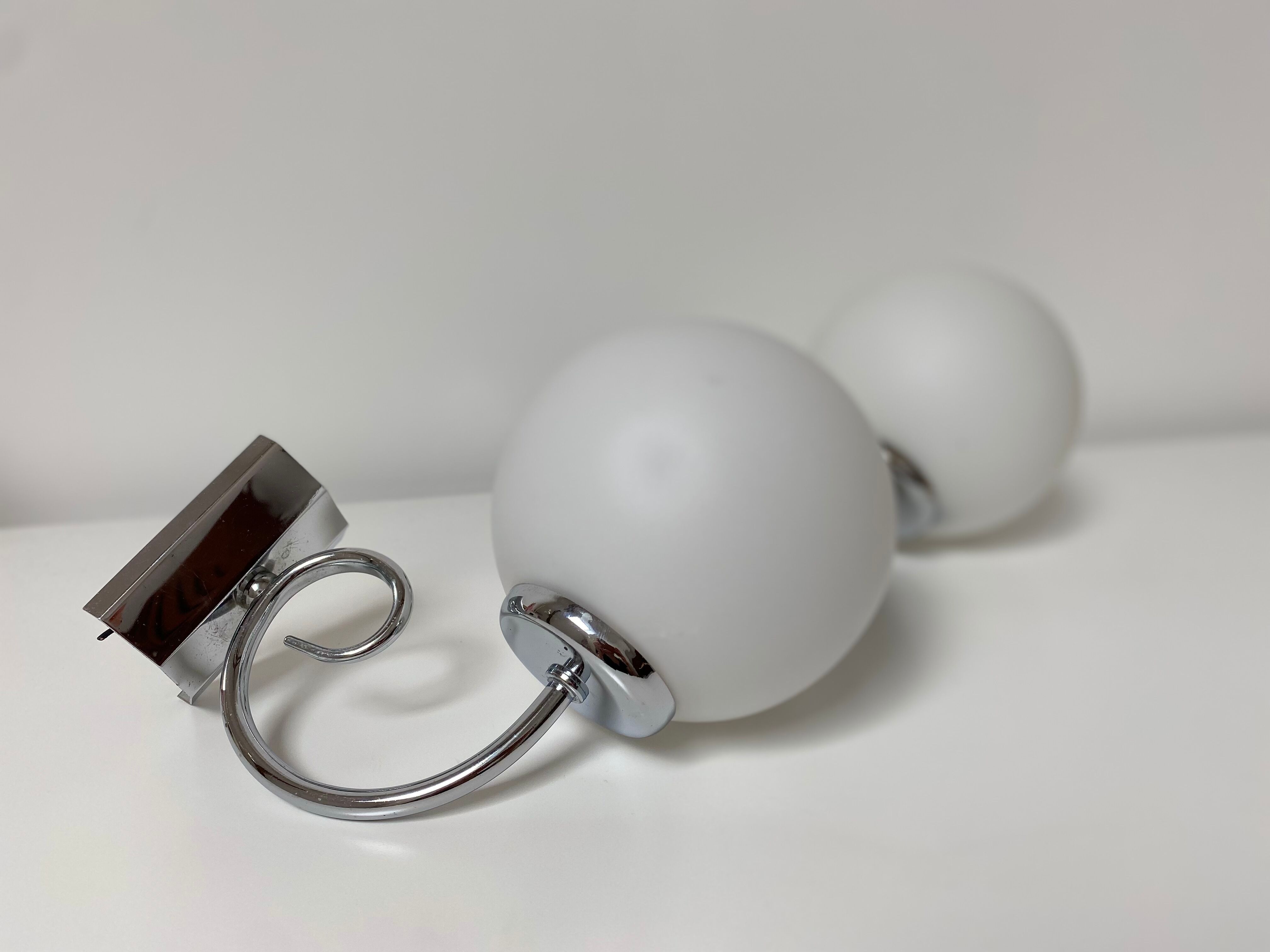 Pair of chrome and opaline metal wall lamps