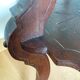 Triplet console harness in carved wood