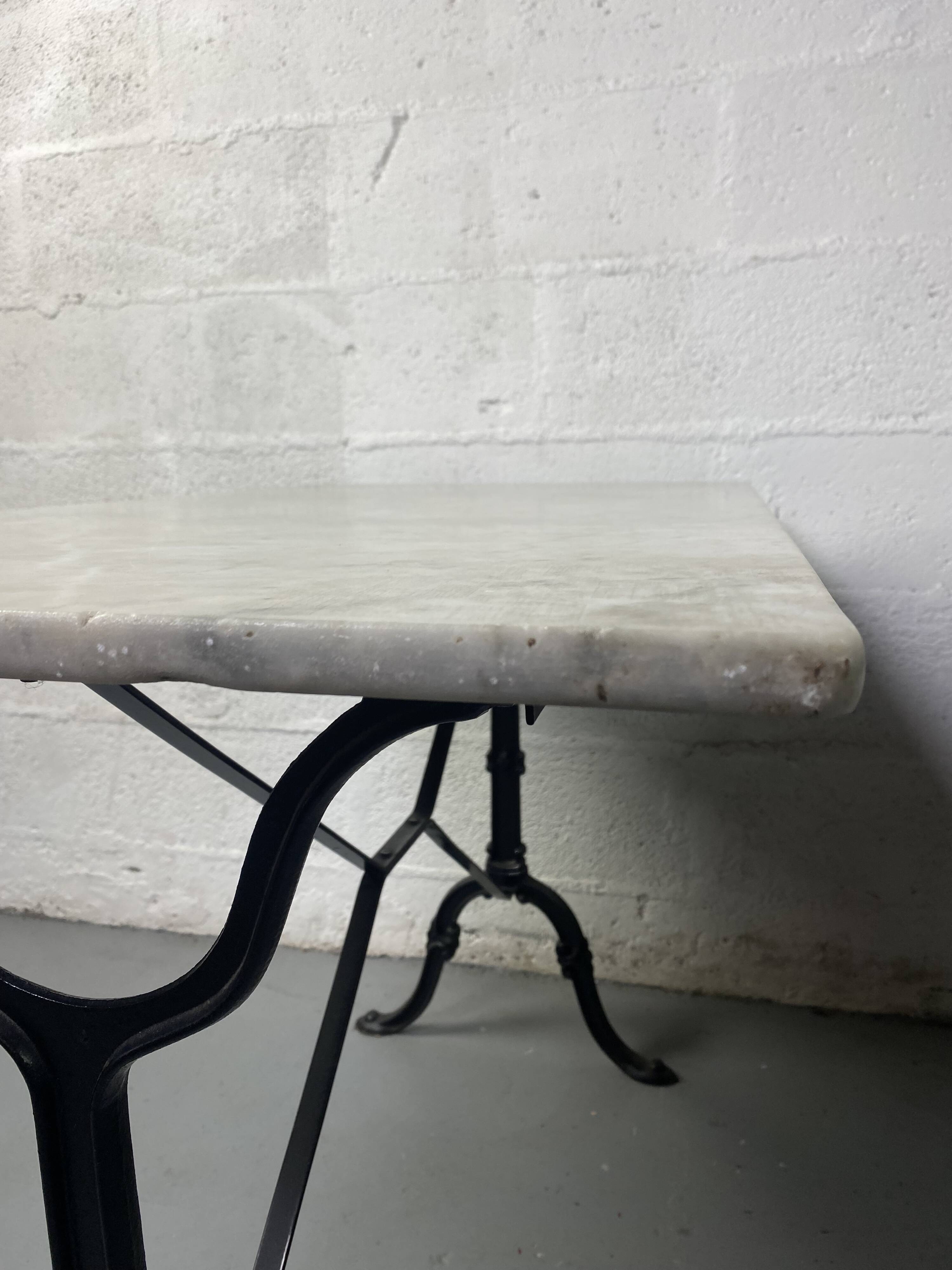 Set of two bistro tables in marble and wrought iron