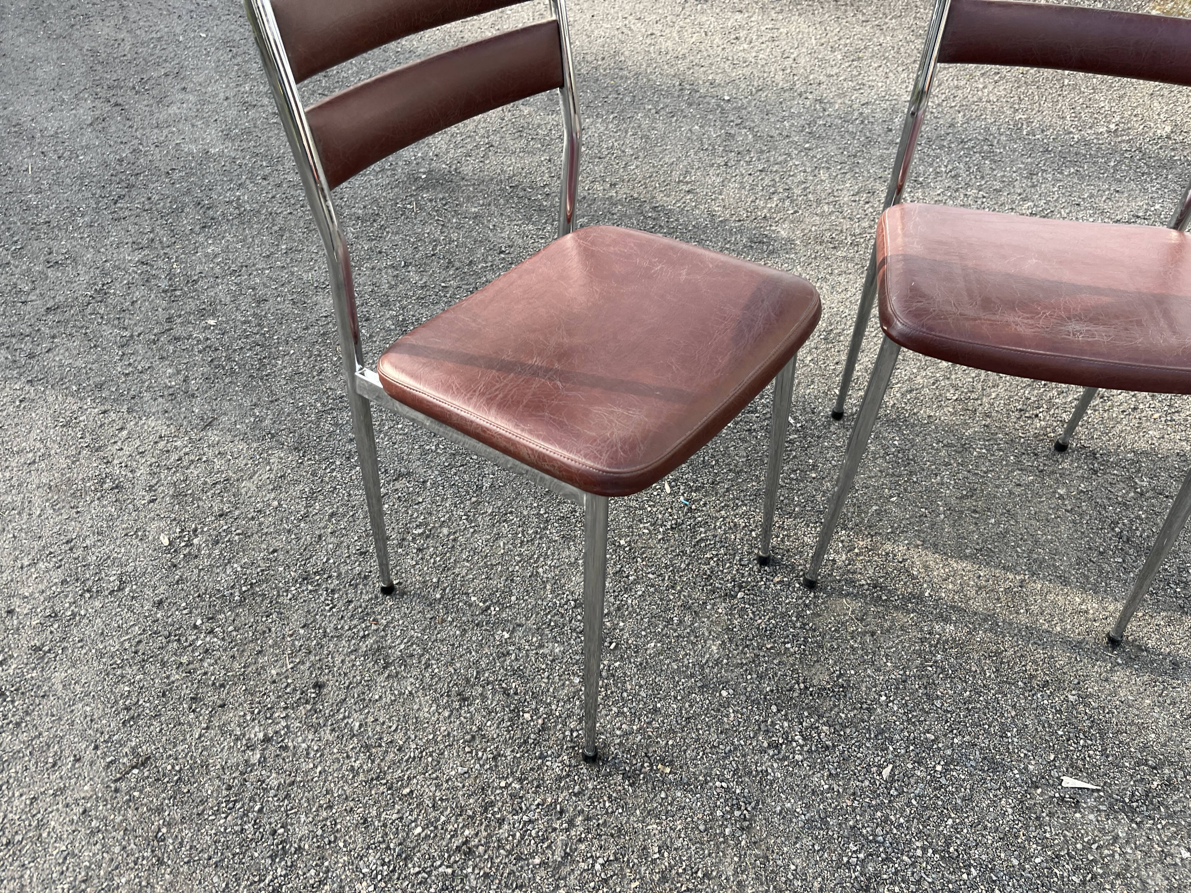 Pair of retro metal and leather chairs
