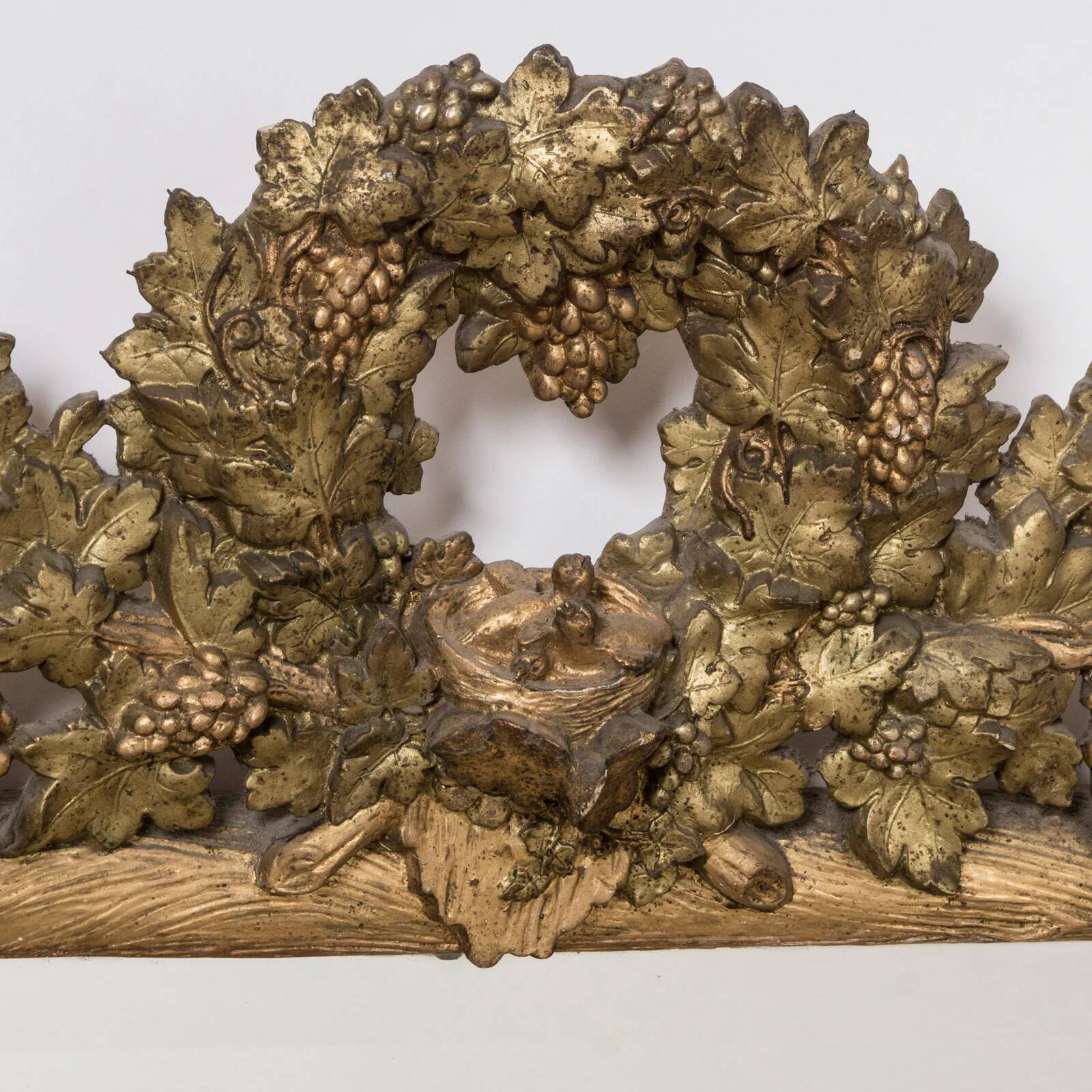 Antique faux wood mirror with bird's nest, 19th century