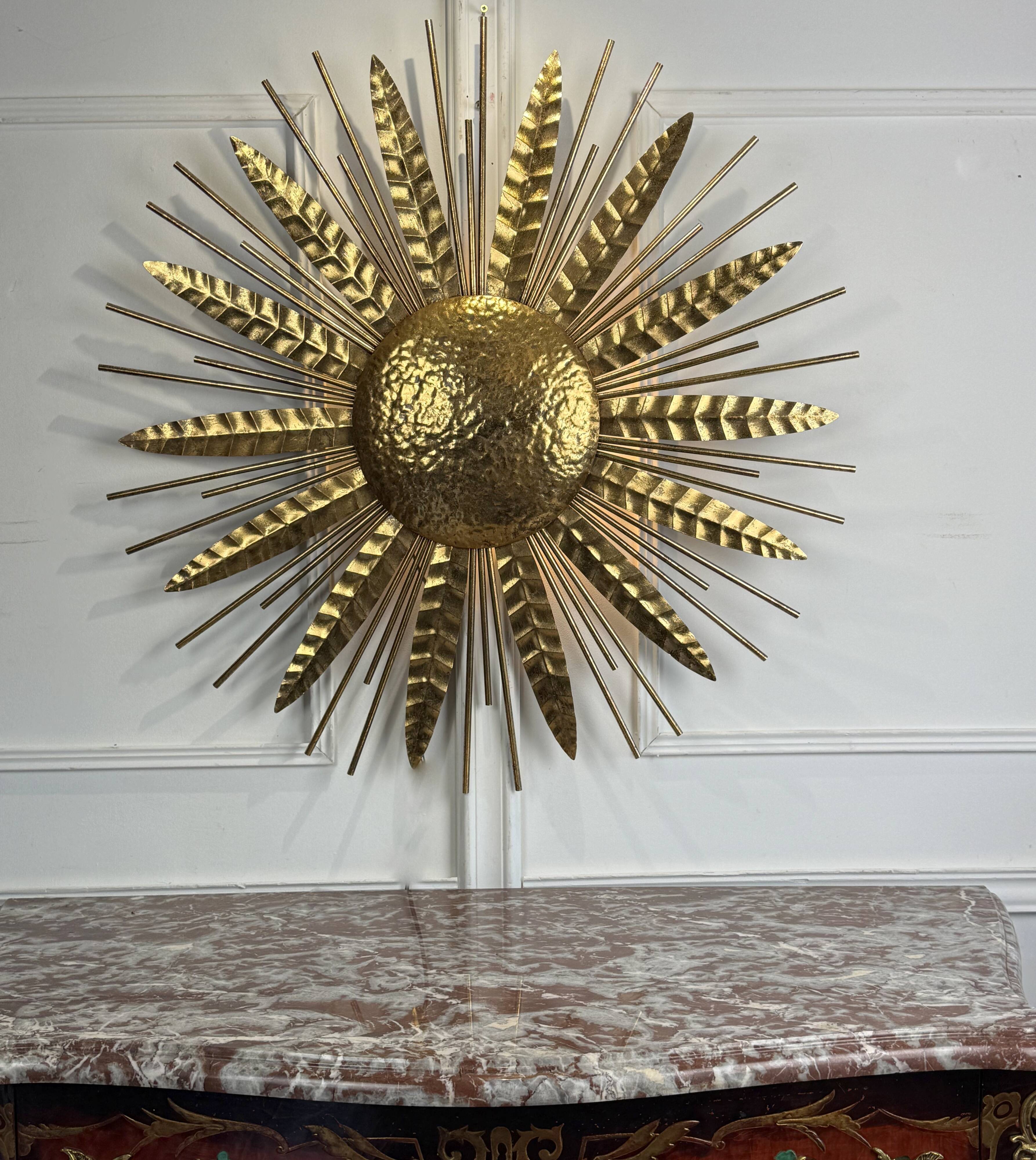 Large golden hammered metal sun wall light with a diameter of 90 cm from the year