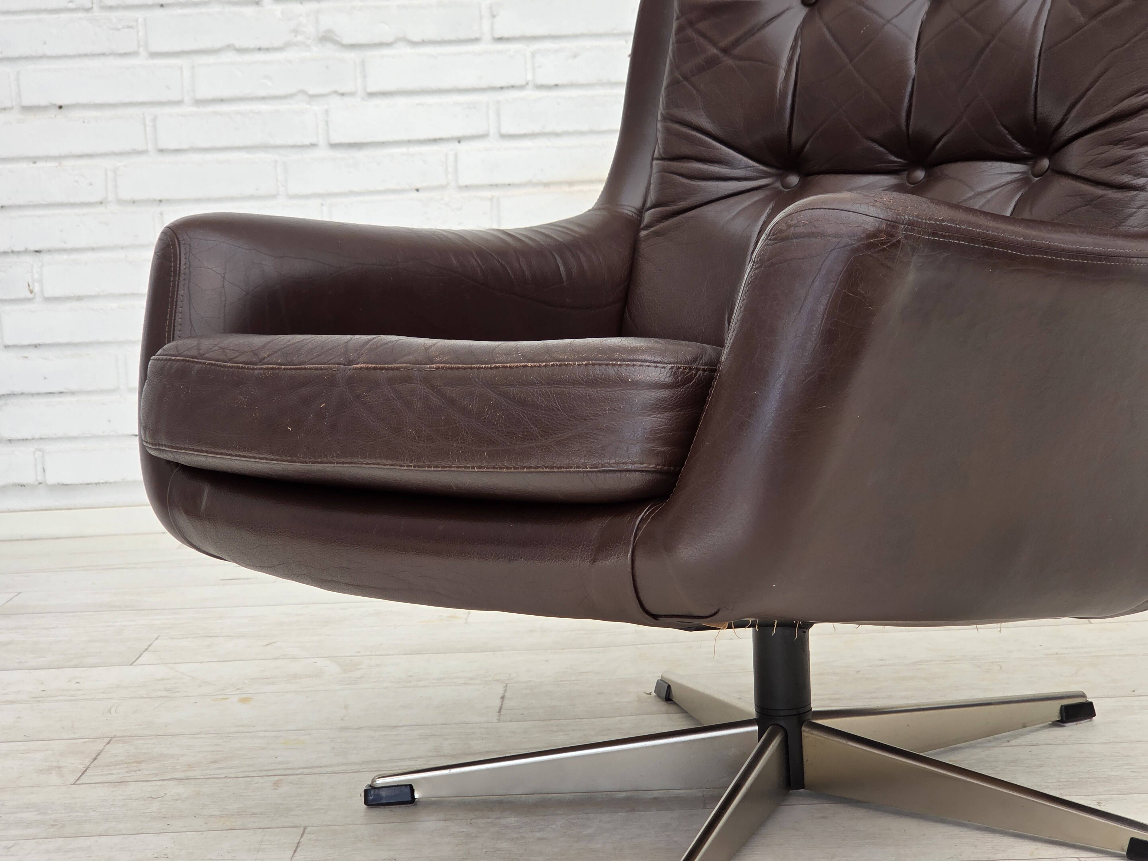 1970s, set of two swivel lounge chairs with footstool, leather.